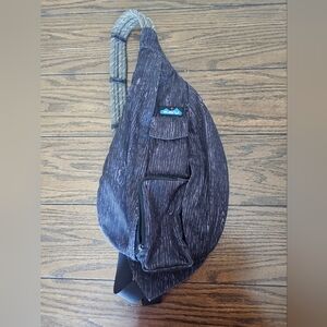 Kavu sling bag black and grey wood grain pattern